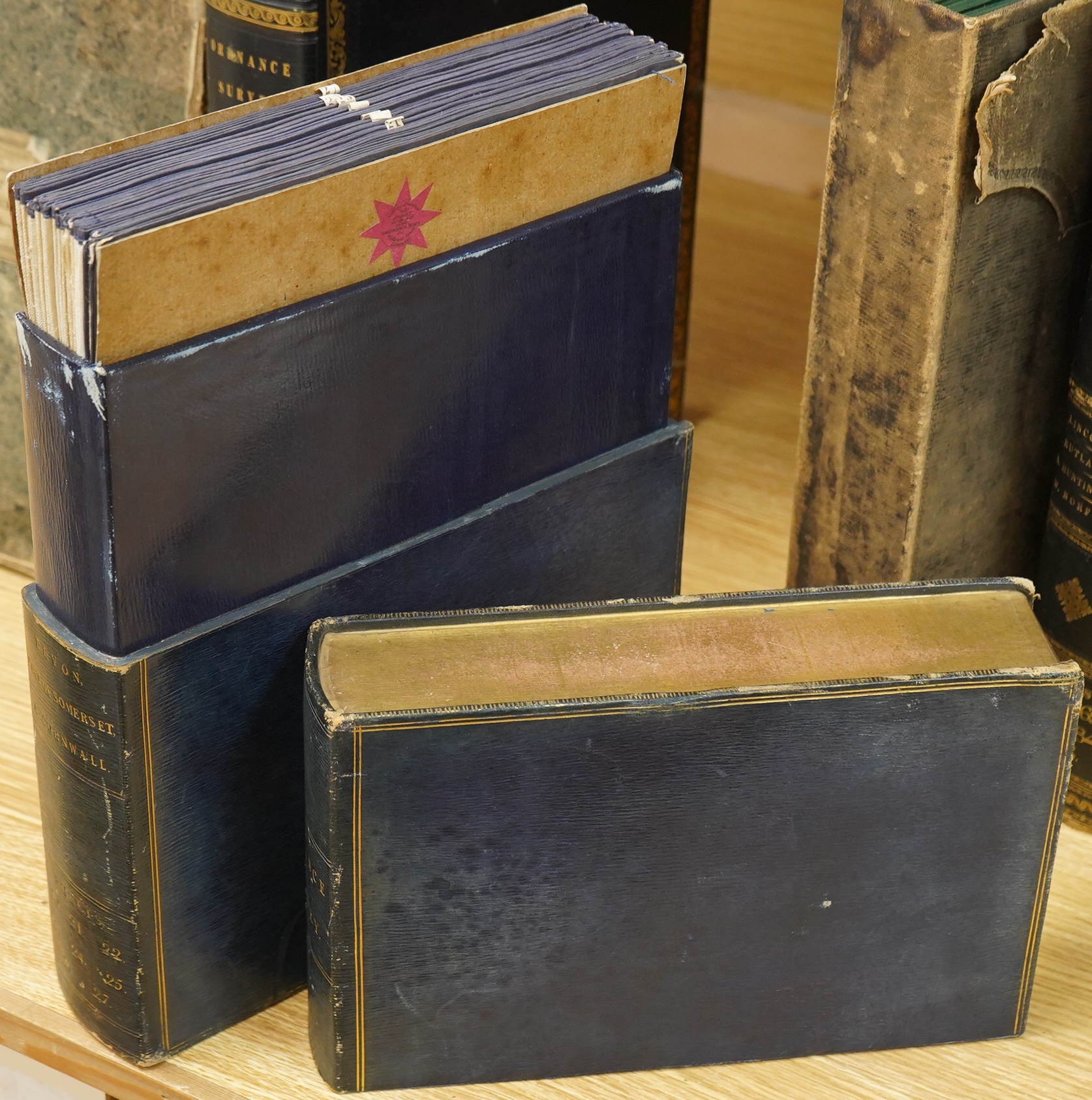 Ordnance Survey maps of Devon, including part of Somerset and Cornwall, comprising of a set of eight engraved maps mounted on linen and edged with blue cotton, including sheet no.s; 20, 21, 22, 23, 24, 25, 26, and 27, pu